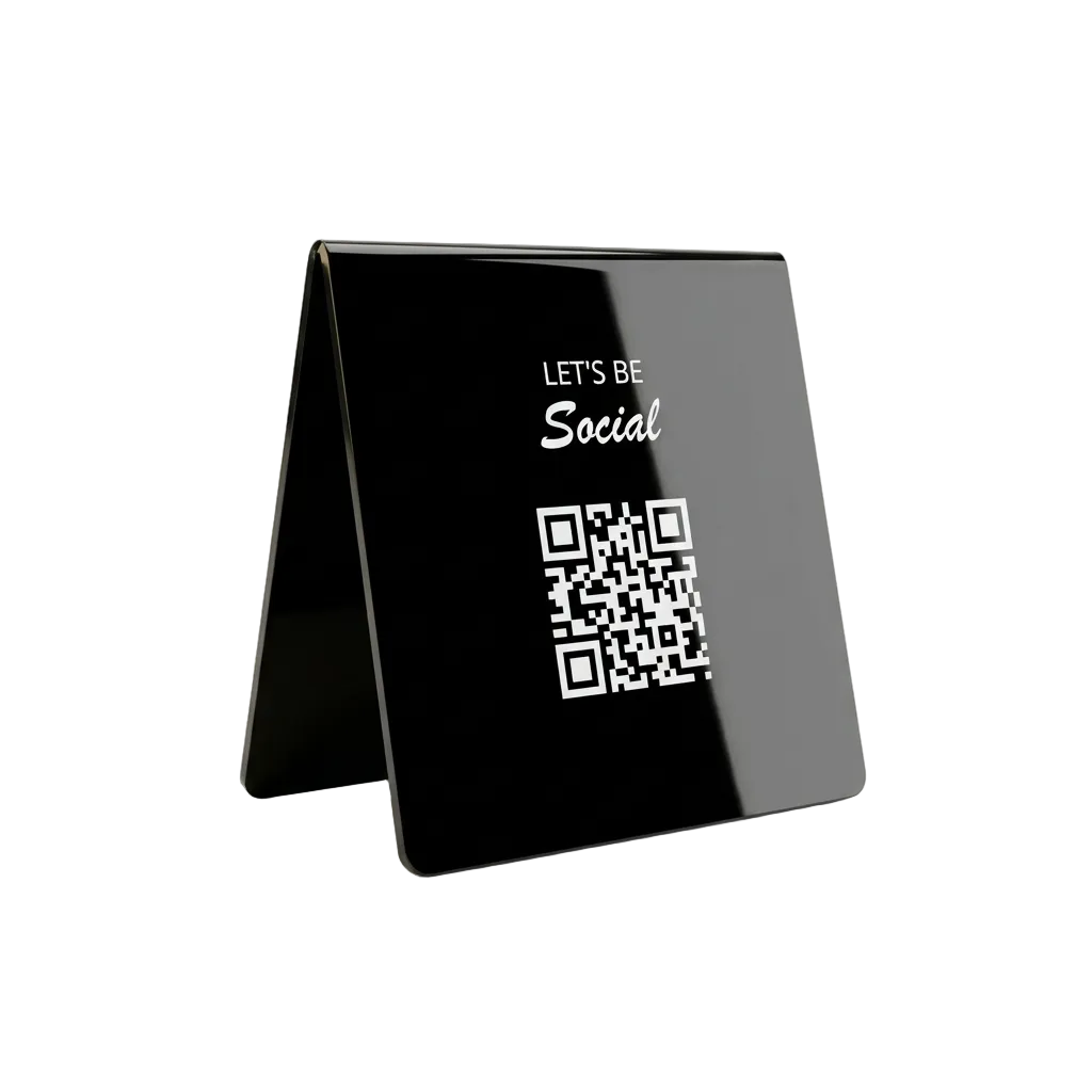 A glossy black acrylic A-frame tabletop sign with white text reading 'LET'S BE Social' above a QR code, shown on a clean white background.