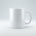 A plain white ceramic mug with a C-shaped handle, shown from a three-quarters angle on a light gray studio background.