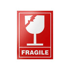 A rectangular red and white 'FRAGILE' shipping symbol card featuring a broken wine glass icon, shown on a light gray background.