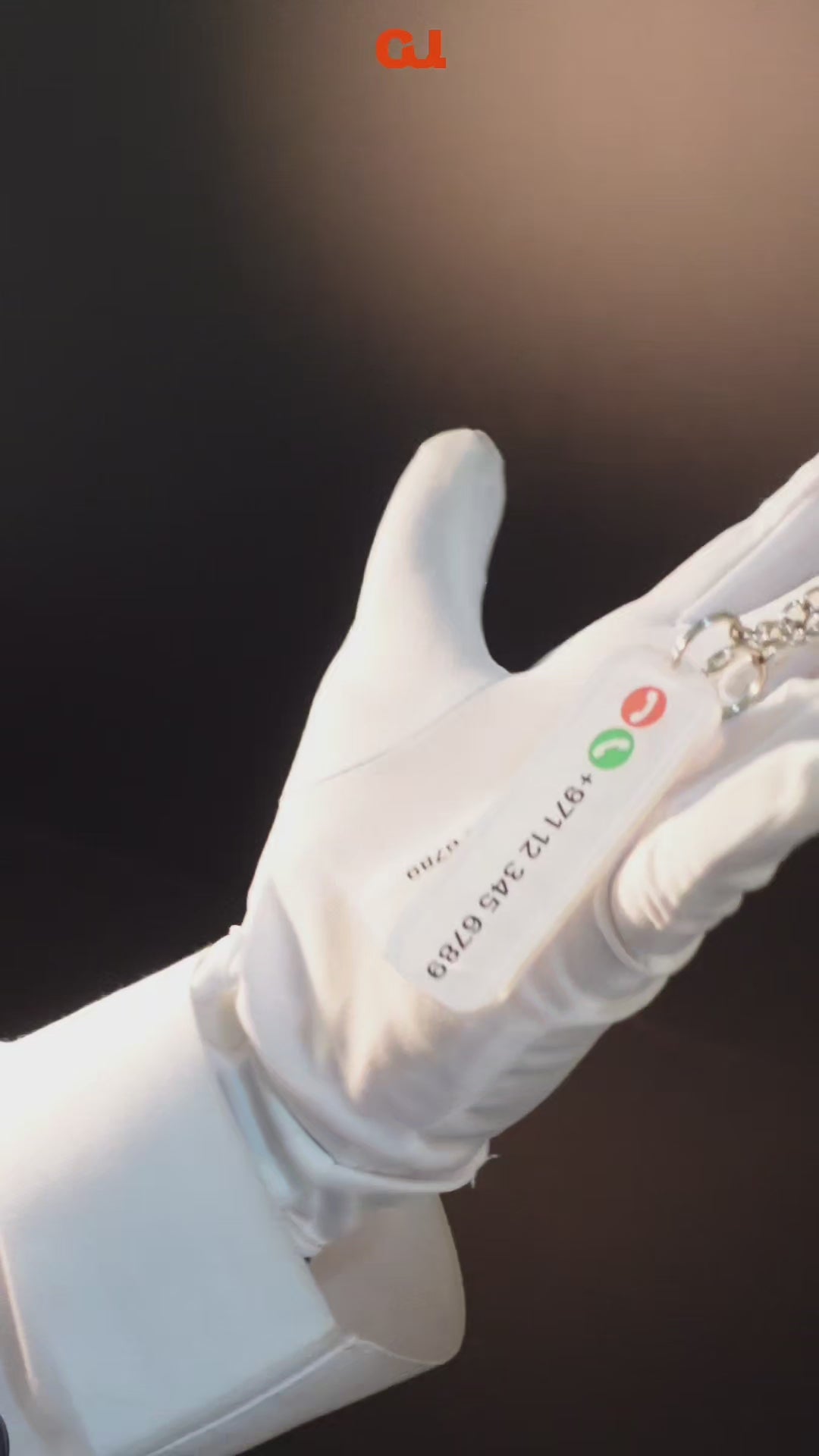 Video of showcasing phone number keychain